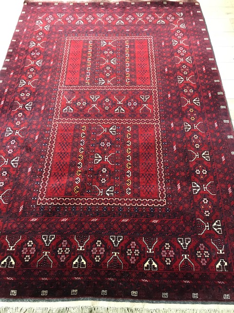 A Persian Tabriz style red ground carpet 252 x 173cm